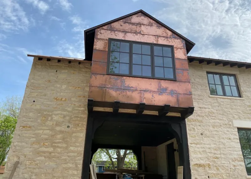 Copper metal panel facade on a stone building for Skylight Installation in Carolina Forest